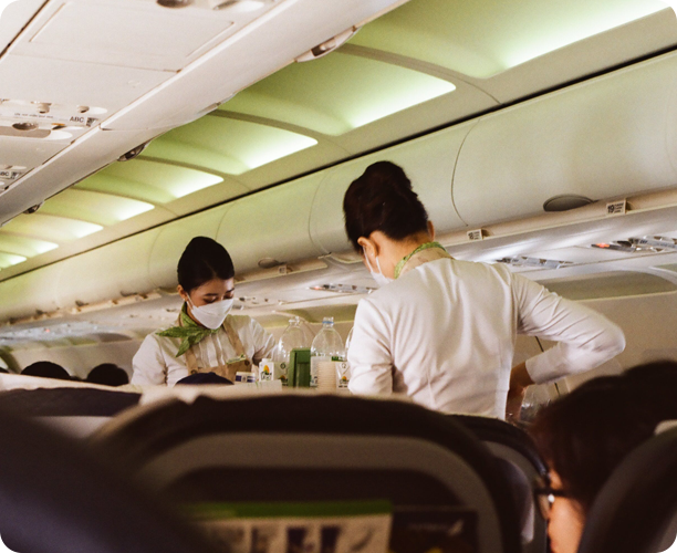 A person on an airplane with a mask